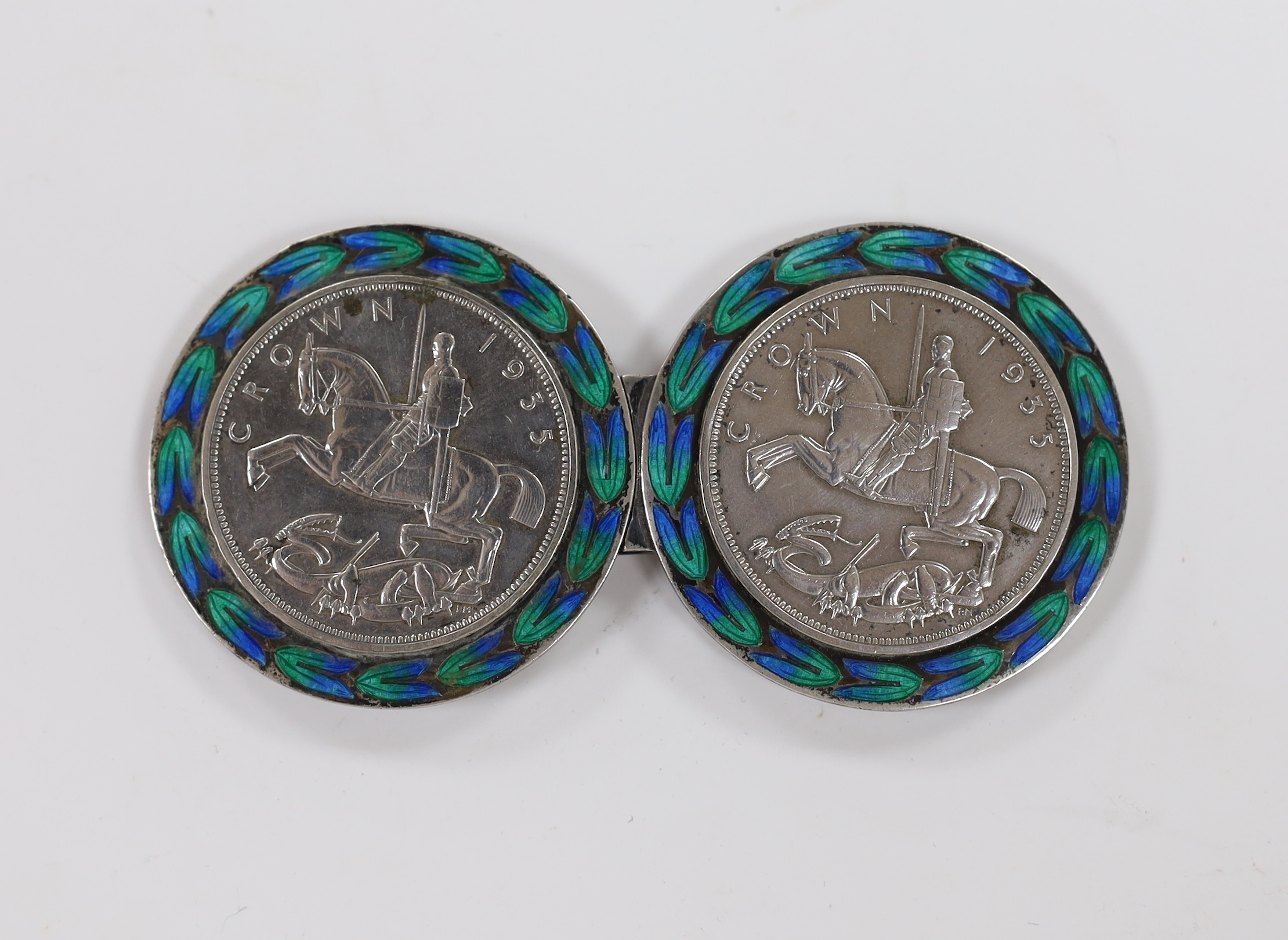 A 1930's white metal and two colour enamelled mounted twin 1933 crown coin belt buckle, stamped 'Liberty Silver', 10mm.